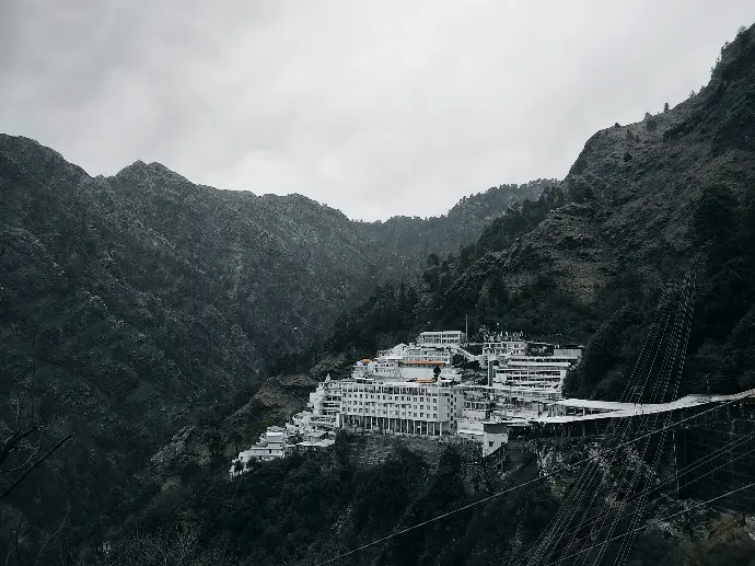a large white building sitting on top of a mountain